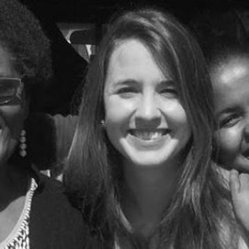 Janina jochim Janina is in a black and white photo with a group of women smiling directly at the camera.